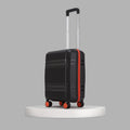 Black small cabin suitcase with telescopic handle and side red stripe detail