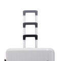 Hard-shell luggage set with three stacked trolley handles in white and dark grips