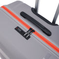 Hard-shell suitcase top panel with orange zipper, carry handle, and black strap