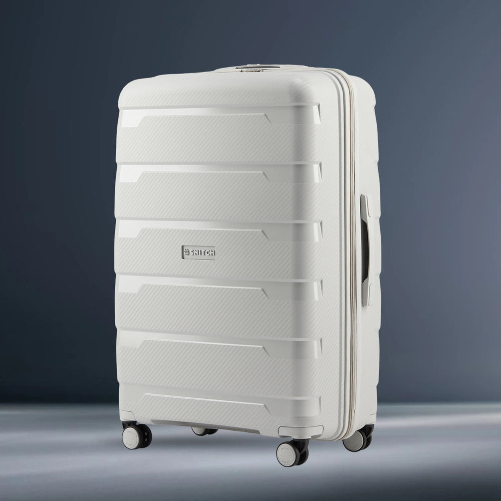 Light grey large check-in trolley suitcase, ribbed panels, four spinner wheels