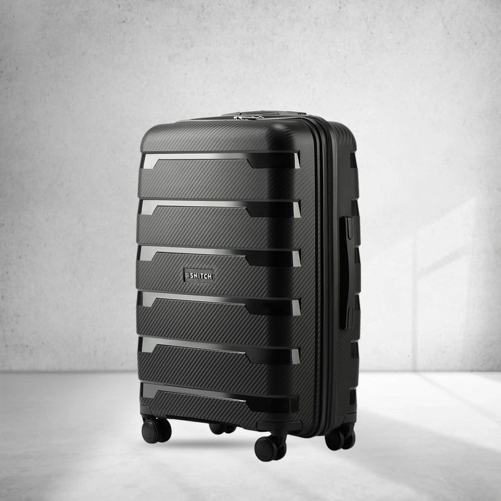Medium check-in trolley suitcase, black polypropylene shell with spinner wheels
