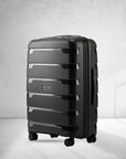 Medium check-in trolley suitcase, black polypropylene shell with spinner wheels