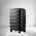 Medium check-in trolley suitcase, black polypropylene shell with spinner wheels