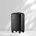 Black cabin trolley with hard shell, telescopic handle, and 4 wheels