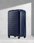 Navy blue polypropylene check-in trolley with 4 wheels and side handle, ridged shell
