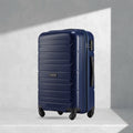 Navy blue polypropylene check-in trolley with 4 wheels and side handle, ridged shell