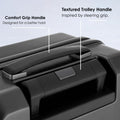 Hard-shell trolley luggage textured handle on top with padded grip and side latch area.