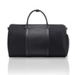 Black duffle bag with two top handles, central panel, and side zip pockets