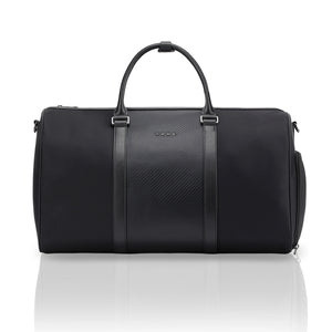Black duffle bag with two top handles, central panel, and side zip pockets