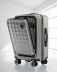 Grey polycarbonate cabin trolley with quilted front panel and side handle, spinner wheels