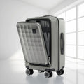 Grey polycarbonate cabin trolley with quilted front panel and side handle, spinner wheels
