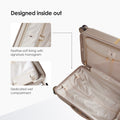Beige hard-shell trolley interior with soft lining, pockets, and zip compartments