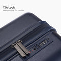 Navy hard-shell luggage close-up of TSA lock on the side with zipper and panel detail