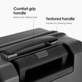 Hard-shell polycarbonate trolley luggage handle area, comfort grip with textured grip panel