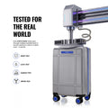 Silver cabin trolley suitcase on test rig with telescopic handle and 8 wheels