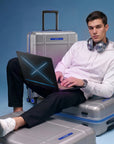 Large check-in trolley with silver polycarbonate body and blue-trim accents