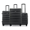 Set of black suitcases with telescopic handles and rolling wheels