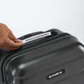 Small cabin suitcase with zip closure; hand shows label strip on top