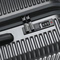Hard-shell suitcase zipper with TSA-style lock and number keypad on grey case