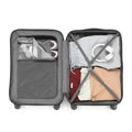 Medium check-in suitcase opened, gray storage panel and folded clothes inside