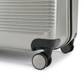 Silver suitcase bottom corner with black caster wheels and smooth side bumper