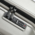 Silver suitcase zip track with recessed handle and HRX combination lock panel
