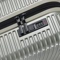 Silver small cabin suitcase close-up of zipper track and built-in 4-digit lock