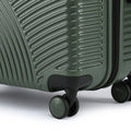 Medium check-in suitcase wheels on dark green ridged shell