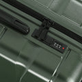 Medium check-in suitcase control panel with combination lock on green hard shell