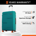 Teal hard-shell suitcase with telescopic handle and front spinner wheels.