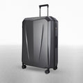 Hard-shell polycarbonate trolley suitcase, dark grey textured shell, corner view with spinner wheels