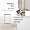 Beige hard-shell polycarbonate trolley luggage with metallic rim wheels and telescopic handle