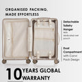 Beige hard-shell suitcase open with organized compartments and detachable toiletry hanger