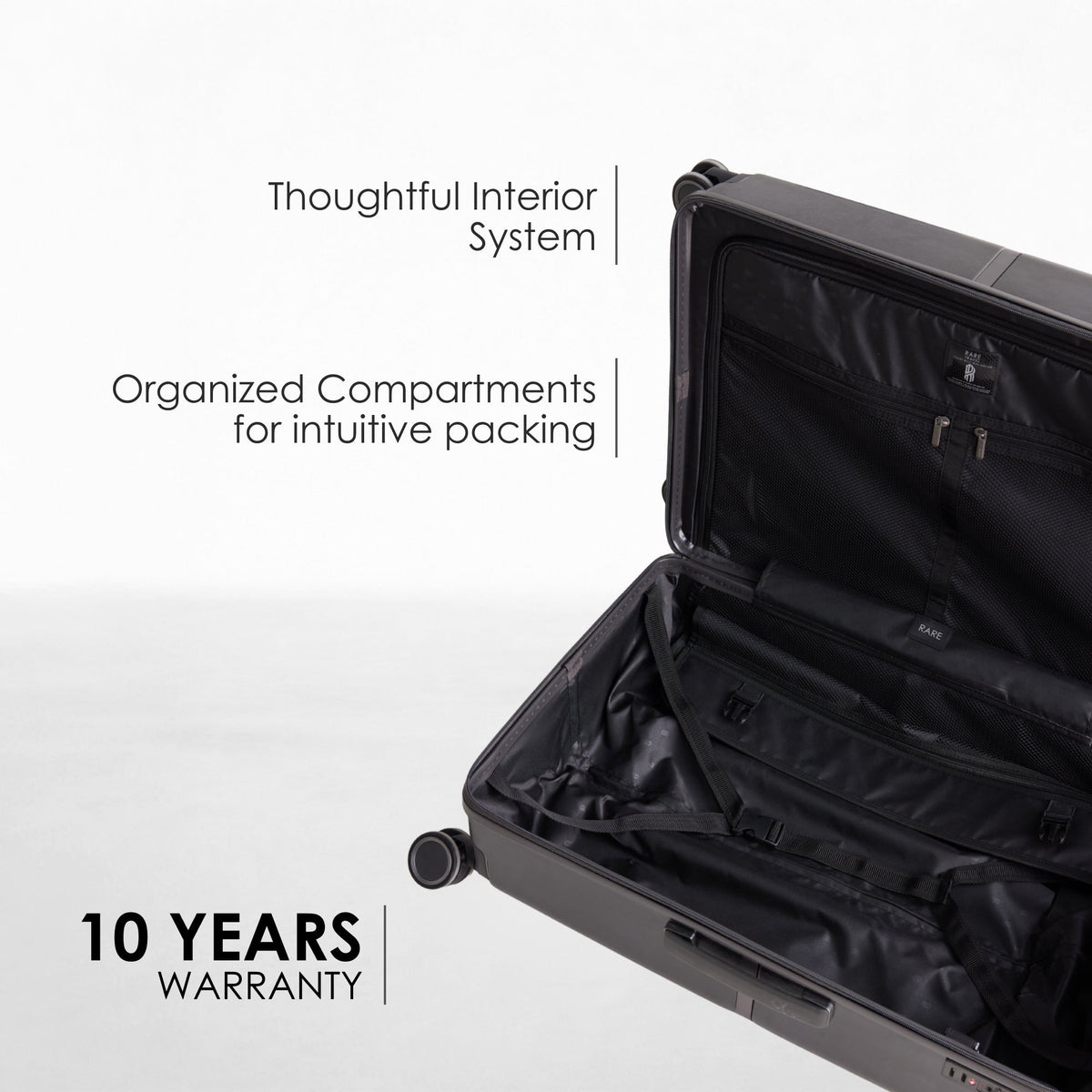 Open medium polycarbonate suitcase with organized compartments and zipper panels