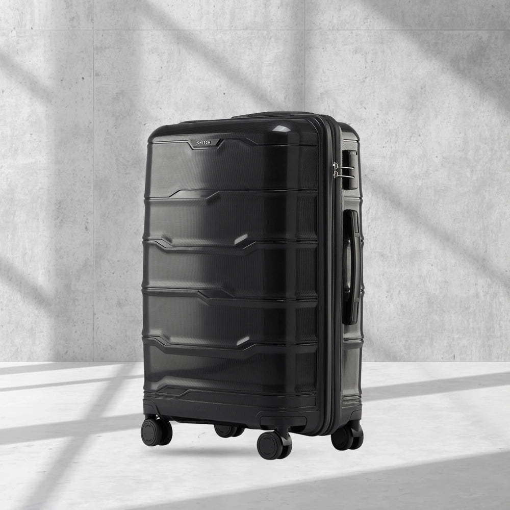 Hard-shell polypropylene check-in trolley suitcase, black, with 8 wheels and side handle