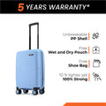 Small cabin suitcase, light blue PP shell, rear three-quarter view, 8 wheels and handle