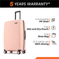 Small cabin suitcase, peach PP shell, close side view with 8 wheels and handle